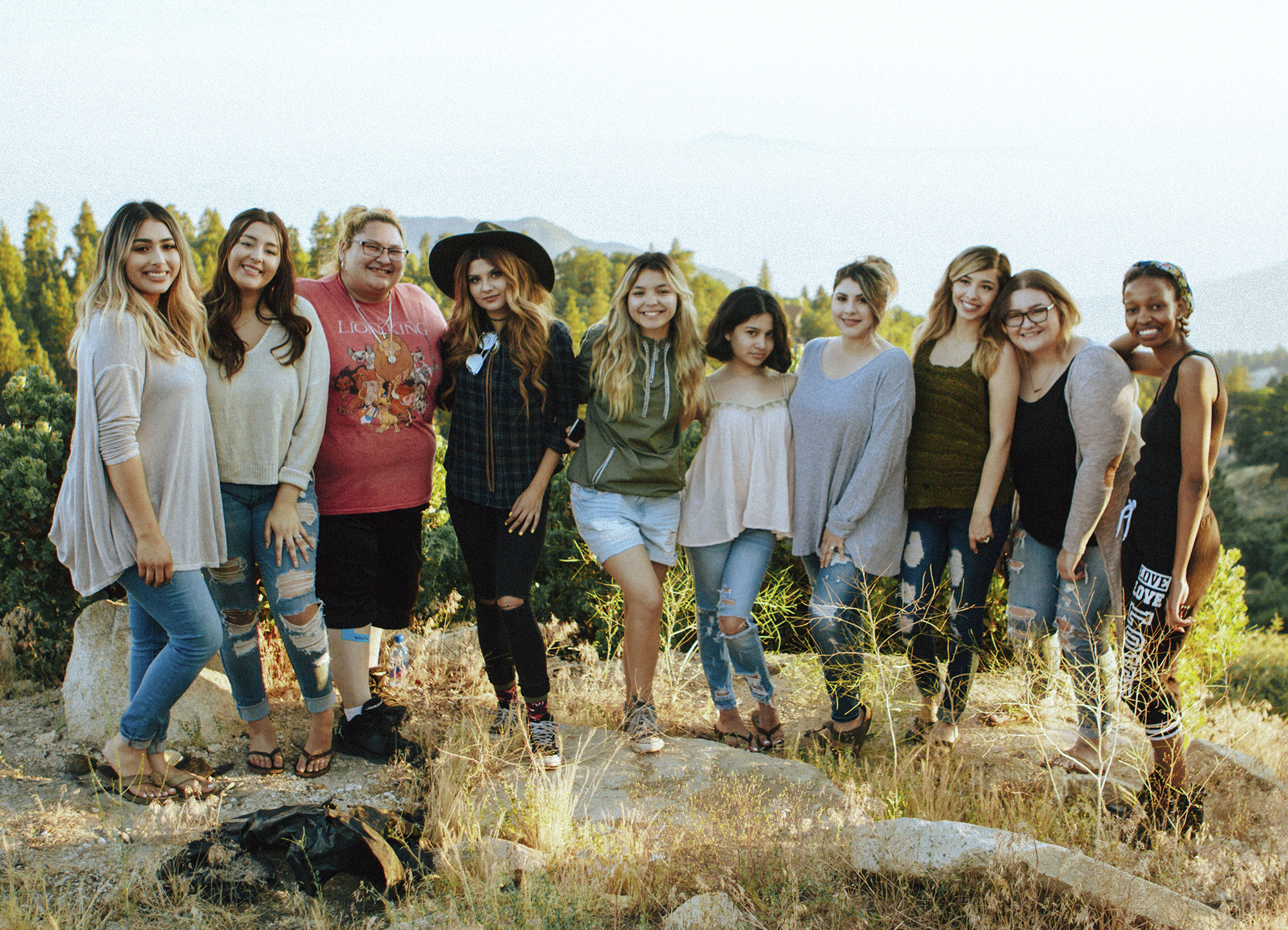 People smiling outdoors.